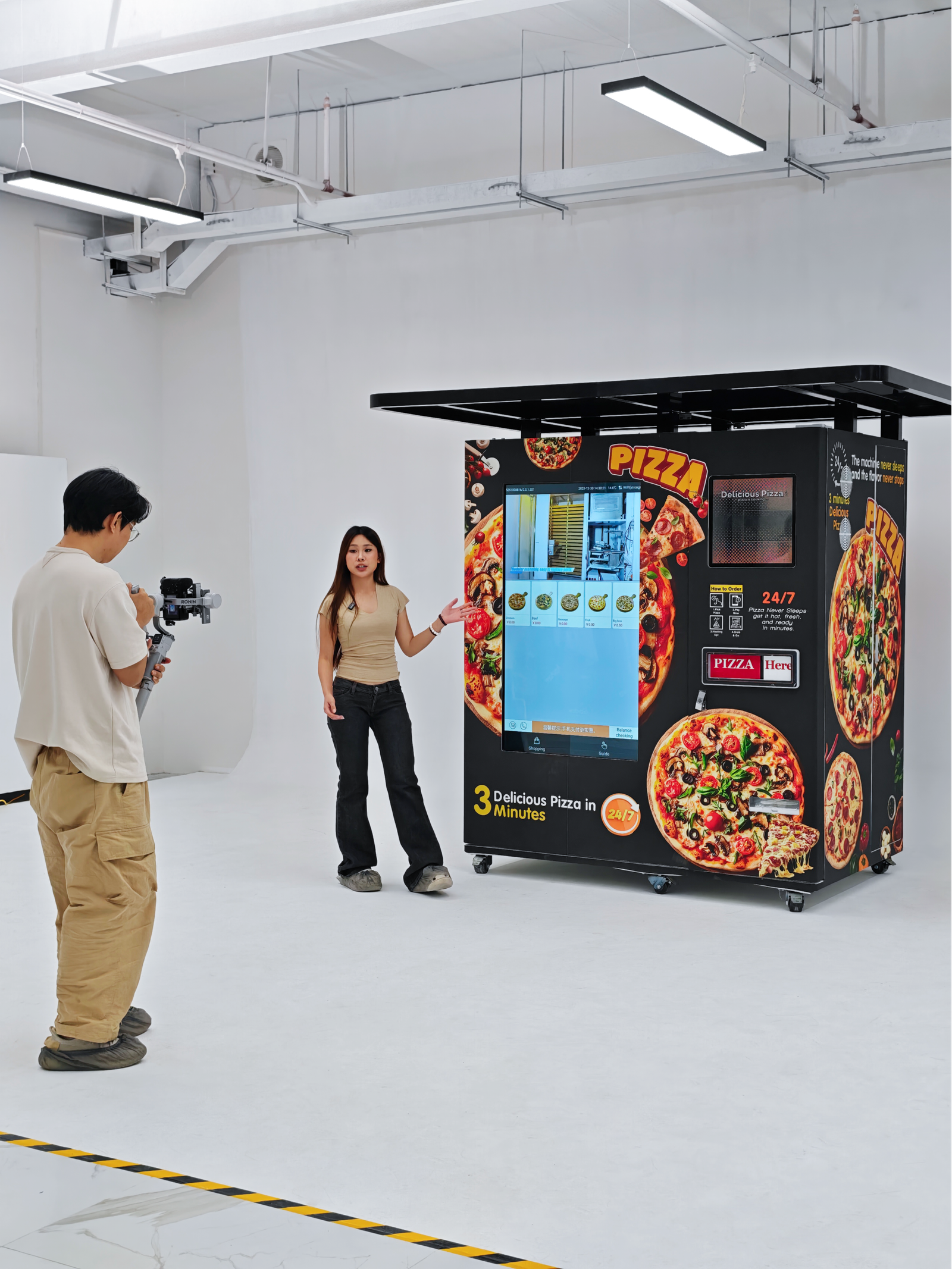 Nova Vending pizza vending machine studio shoot with host presentation and cameraman recording product demonstration