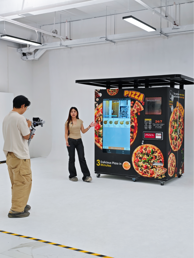 Nova Vending pizza vending machine studio shoot with host presentation and cameraman recording product demonstration